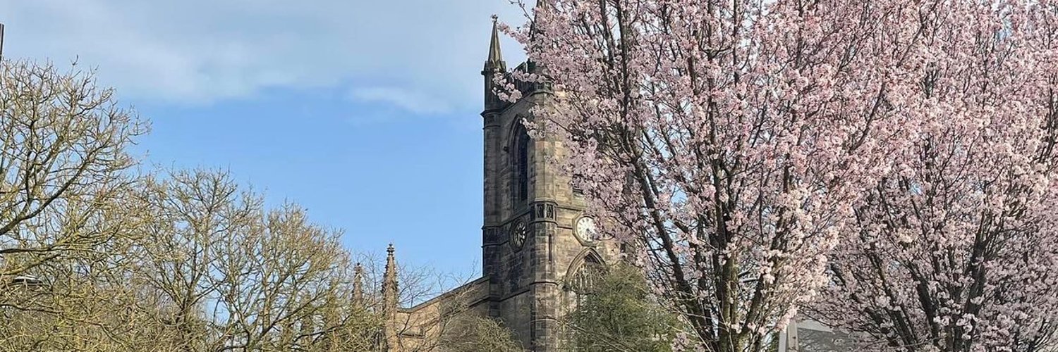 Stoke Minster with cherry blossom tree in front