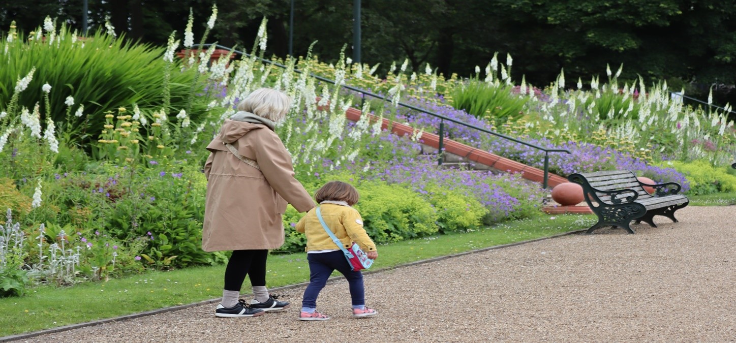 Grandmother and her daughter walking in the park